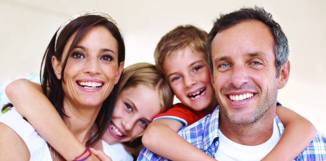 Photo of happy family after finding Baton Rouge LA dentist Dr Chad Biggio through patient reviews