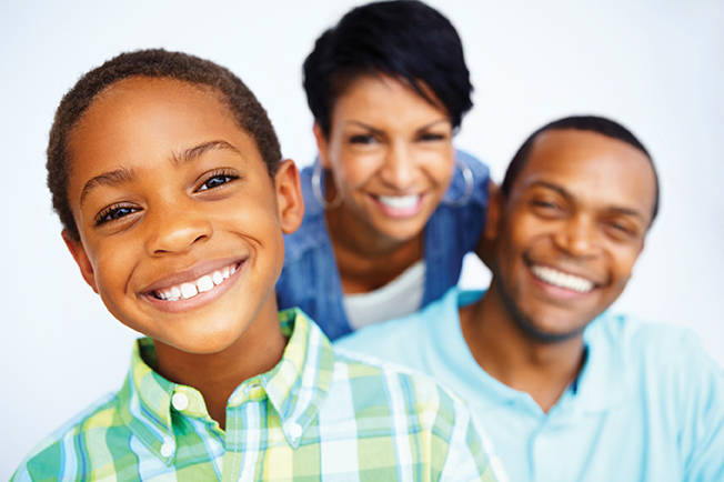 Smiling family after getting dental sealants at Baton Rouge LA dentist